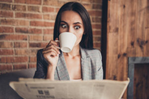 astonished shocked coffee newspaper