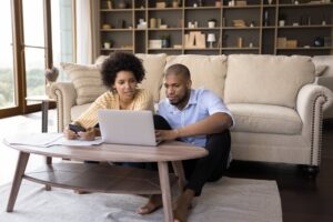 couple at home with device getty
