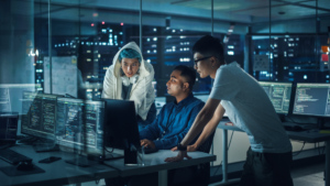 group coding in office at night gettyimages 1356364158 1200x675 c2b5ff2