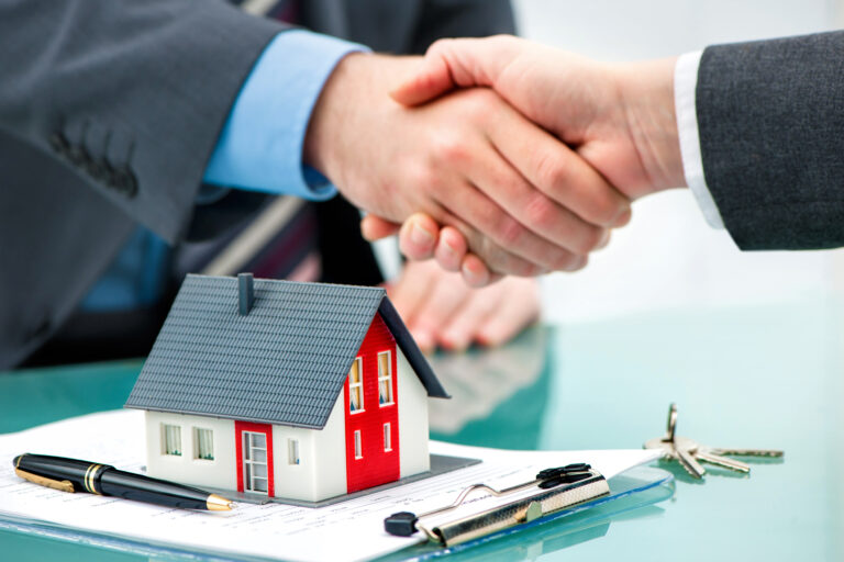 handshake over contract and house mortgage lender source getty