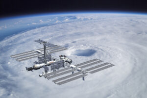 international space station orbiting over a hurricane on earth
