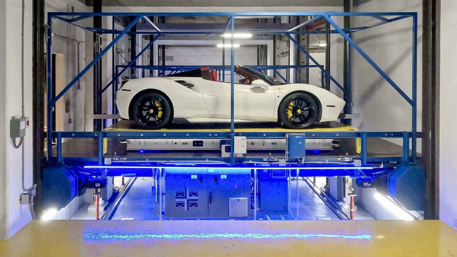 How robots lift, spin and precisely park a Ferrari