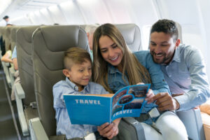 family trip on airplane reading to son 1200x800 5b2df79 1