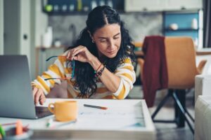 Woman looks over personal finances 3fgv8Bd