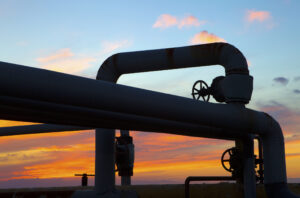 a looping pipeline with the sun setting in the background