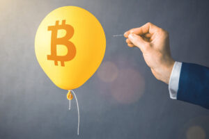 popping bitcoin balloon