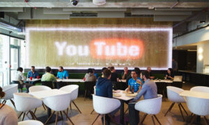 youtube office space with large youtube logo in background alphabet google