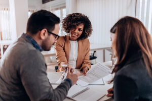 three investors meet with paperwork