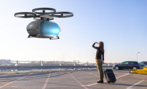 woman with suitcase looks up at a hovering air taxi