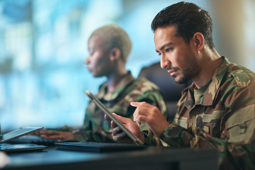 person in the military using a tablet computer