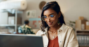 young person looking at laptop