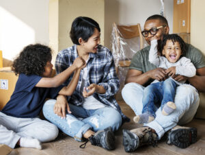 22 01 17 two adults and two children in a room with packing boxes gettyimages 922730214