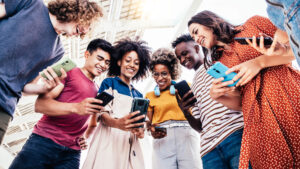 22 09 09 a group of people looking at their cellular phones mf dload