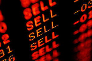 a stock screen with sell in red several times