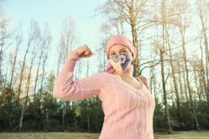 cancer patient flexing muscle