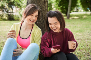 getty two friends happy smiling by tree