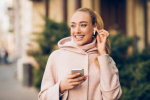 person with airpods in ear apple