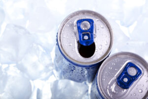two cold soda cans in ice