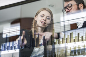 two people analyizing a graph