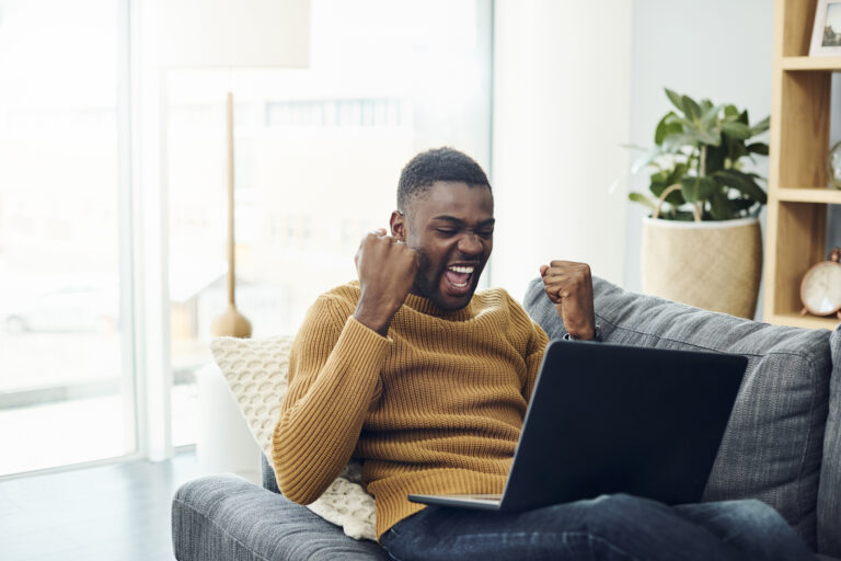 cheering person with laptop